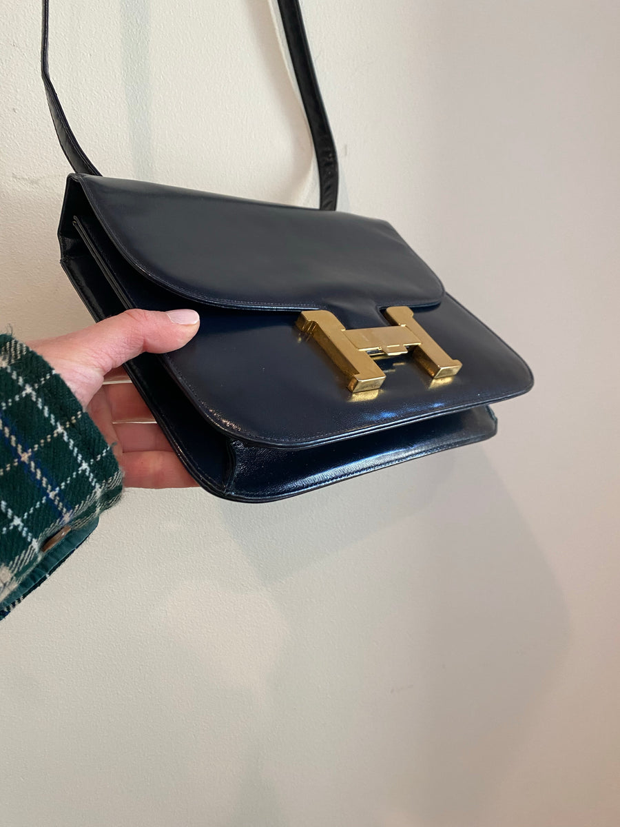 Navy Blue Handbag with Gold "H" Enclosure