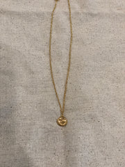 Tiny gold shell necklace