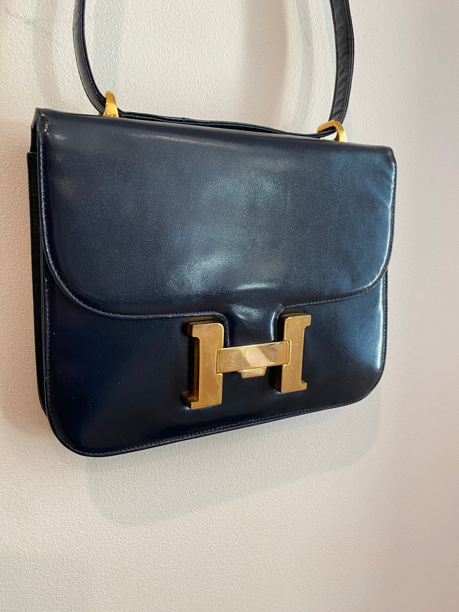 Navy Blue Handbag with Gold "H" Enclosure